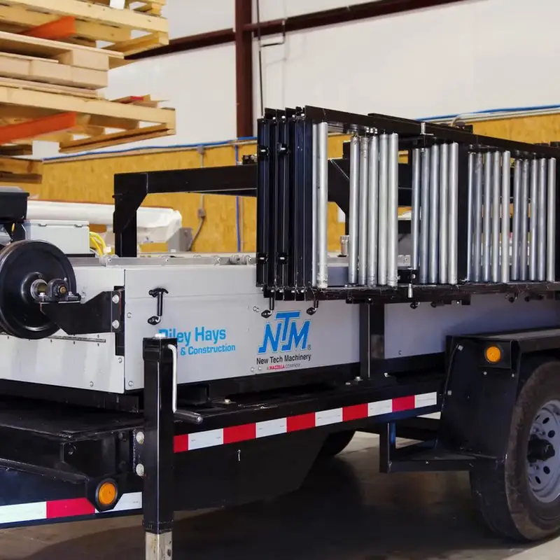 Riley Hays on-demand roll form machine fabricating metal roofing panels – click to watch
